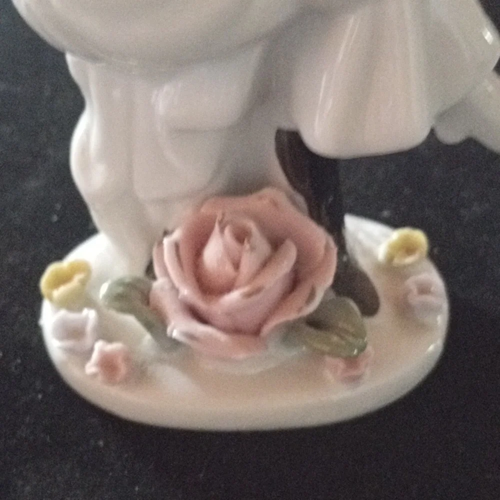 Porcelain Figurine with Floral Base